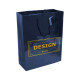 Shopper in carta laminata. Maniglie con cordino